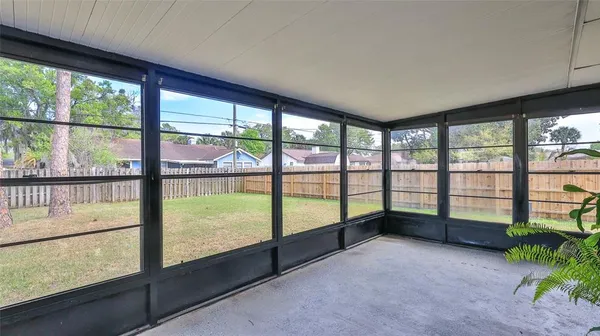 a view of an empty room with a large window