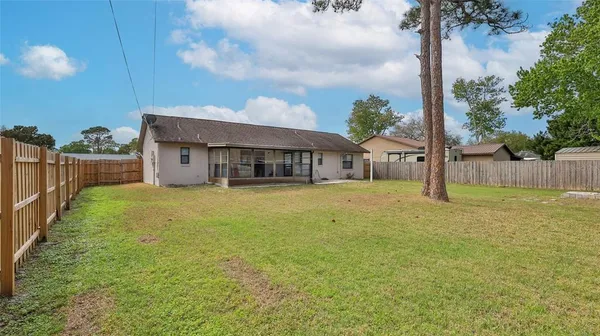 a house view with swimming pool in front of it