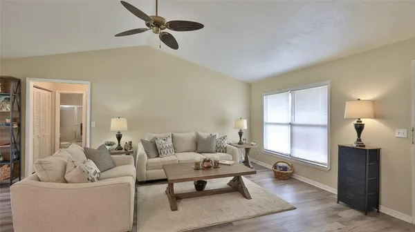 a living room with furniture and a window