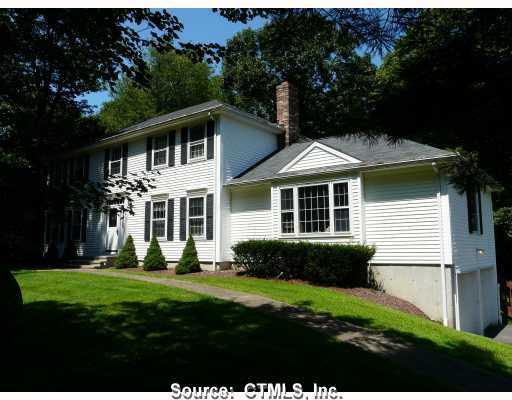 12 Meadow Brook Road Newtown, CT 06470 - Photo 1 of 1 a front view of a house with a yard