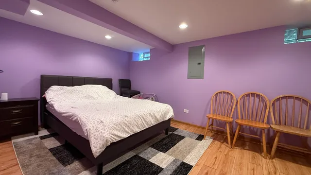 a bedroom with a bed and a table