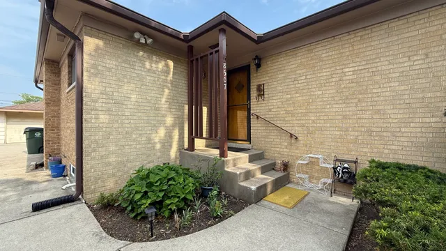 a view of a brick house with outdoor space