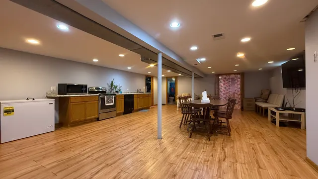 a kitchen with a table and chairs in it