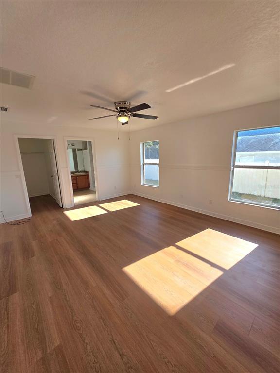 12 Juniper Loop Drive Ocala, FL 34480 - Photo 5 of 14 wooden floor in an empty room with a window