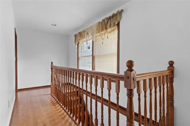 a view of a porch with wooden floor