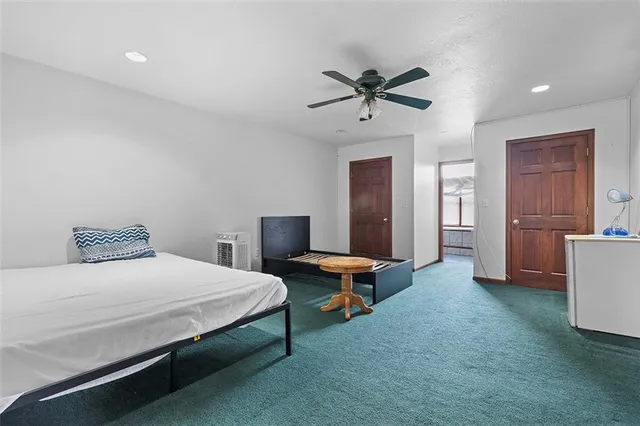 a bedroom with a bed and furniture