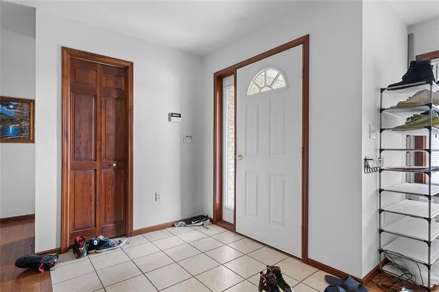 a view of an entryway with wooden floor