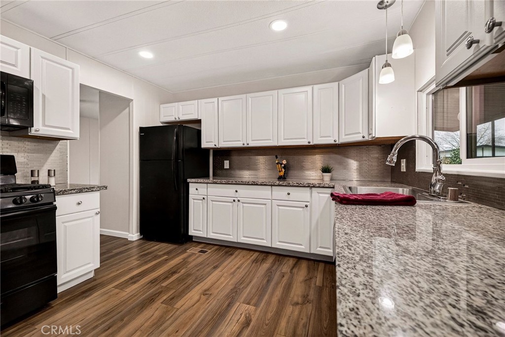 3548 Vía Medio Chico, CA 95973 - Photo 2 of 48 a kitchen with stainless steel appliances granite countertop a refrigerator sink and stove
