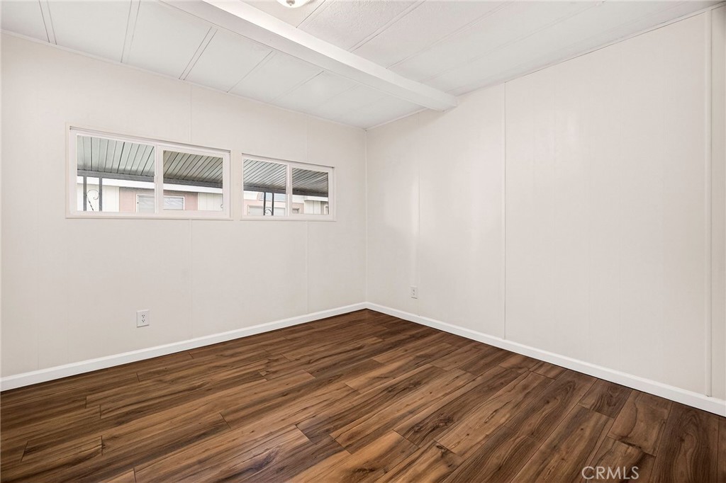 3548 Vía Medio Chico, CA 95973 - Photo 23 of 48 a view of an empty room with wooden floor and a window