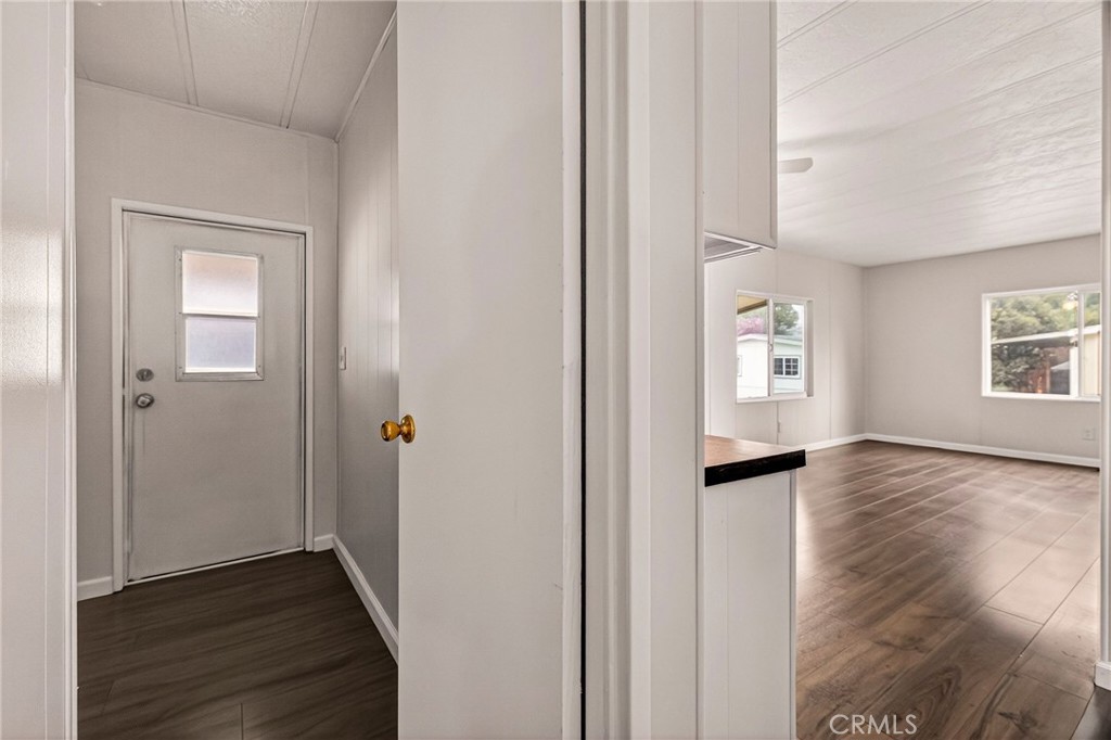 3548 Vía Medio Chico, CA 95973 - Photo 27 of 48 an empty room with wooden floor closet and windows