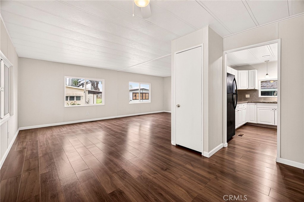 3548 Vía Medio Chico, CA 95973 - Photo 10 of 48 a view of a kitchen with wooden floor and a refrigerator