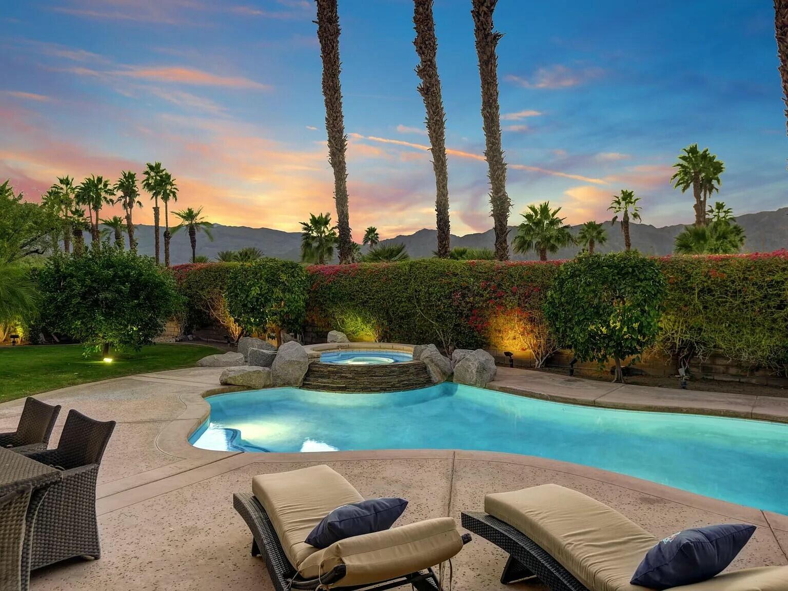 a view of a backyard with sitting area