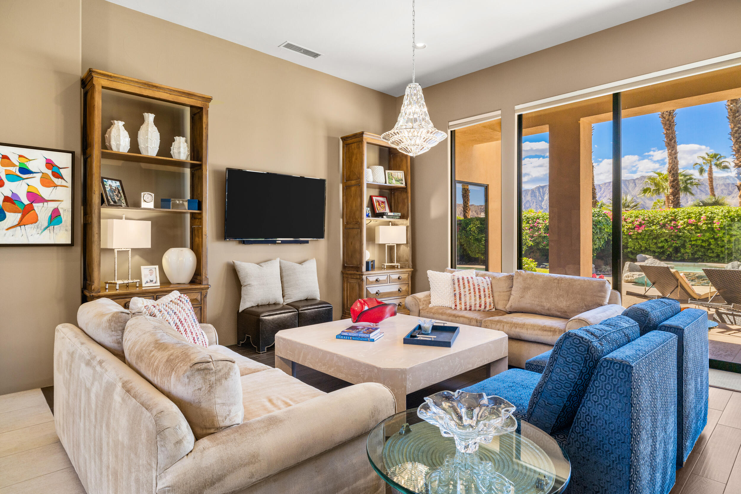 50445 Mountain Shadows Road La Quinta, CA 92253 - Photo 12 of 33 a living room with furniture and a flat screen tv