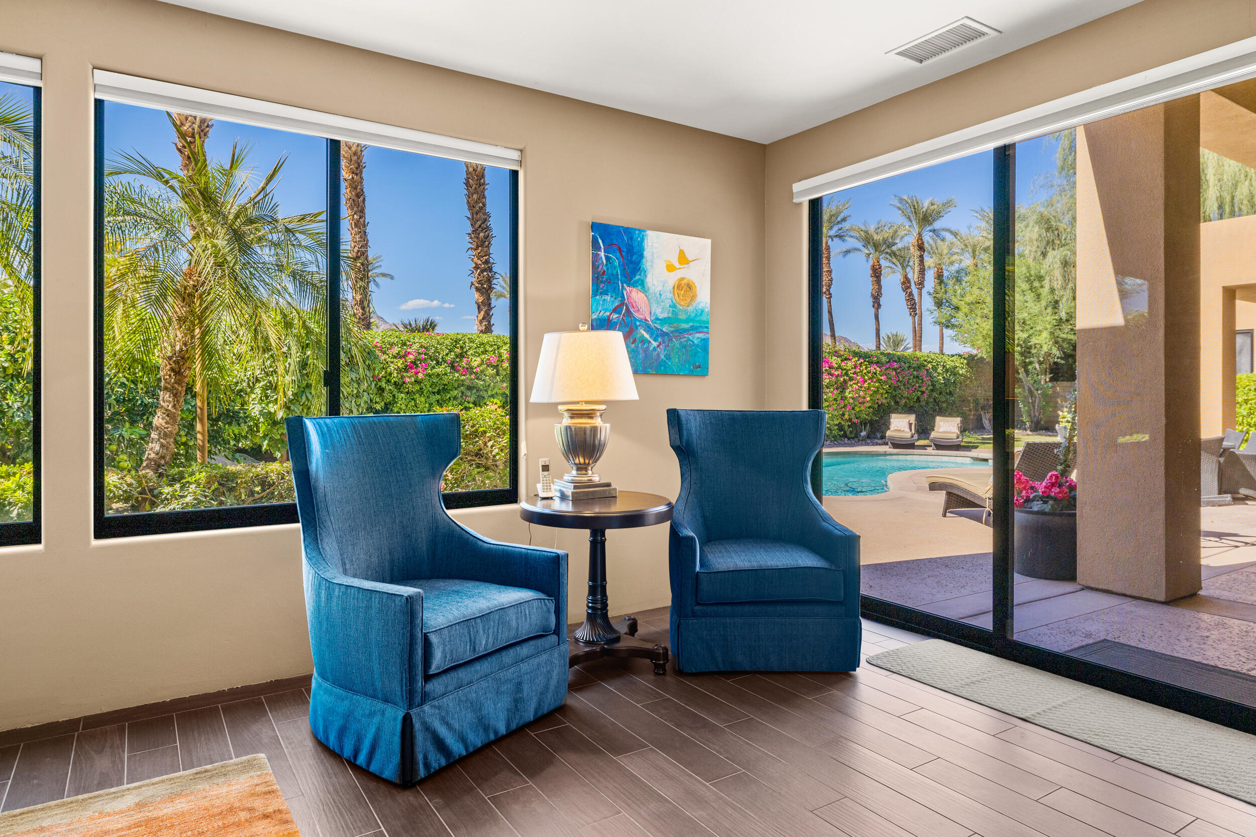 50445 Mountain Shadows Road La Quinta, CA 92253 - Photo 21 of 33 a living room with furniture and a large window
