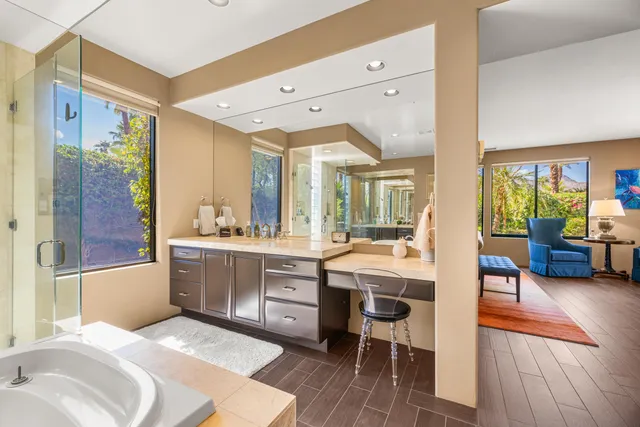 a large white kitchen with a large window