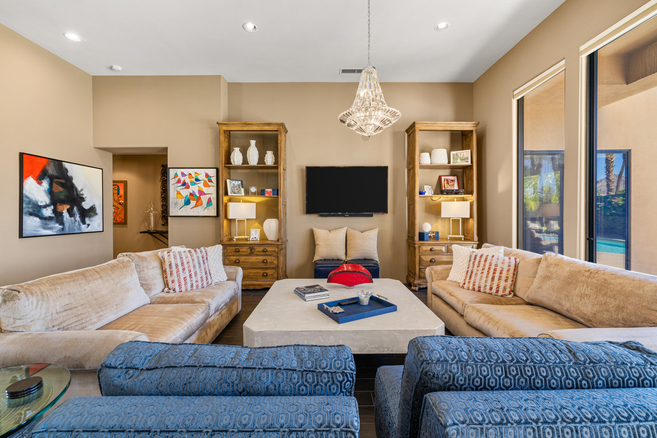 50445 Mountain Shadows Road La Quinta, CA 92253 - Photo 9 of 33 a living room with furniture kitchen view and a flat screen tv