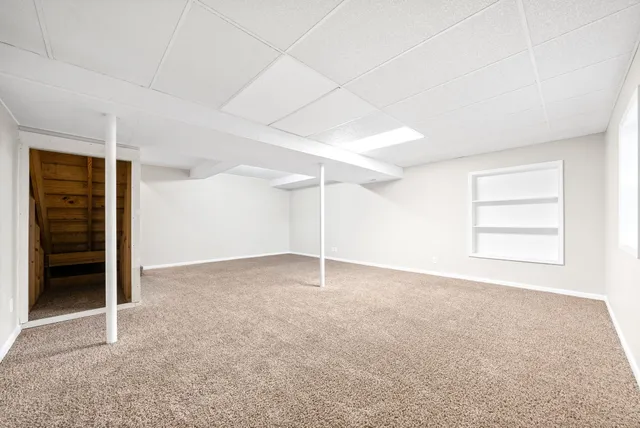 a view of a room with wooden walls