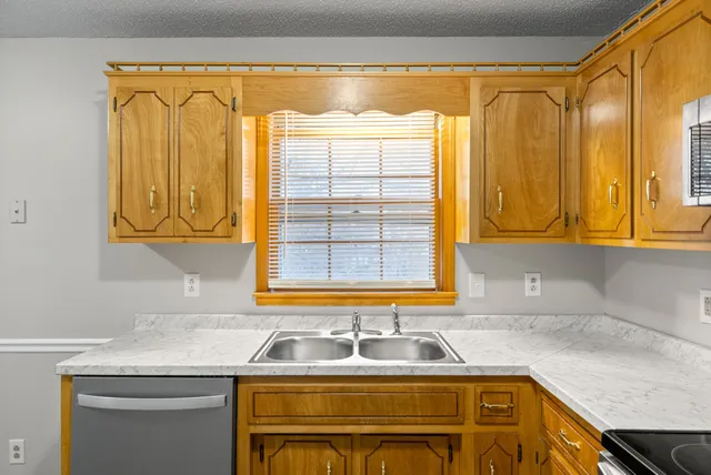 a kitchen with a sink and a window