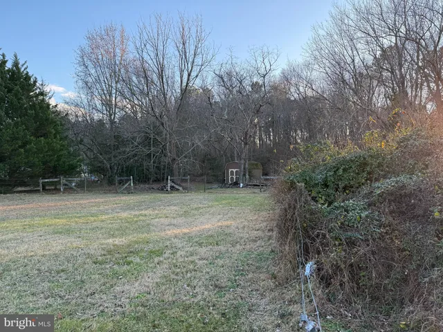 a view of outdoor space with deck and yard