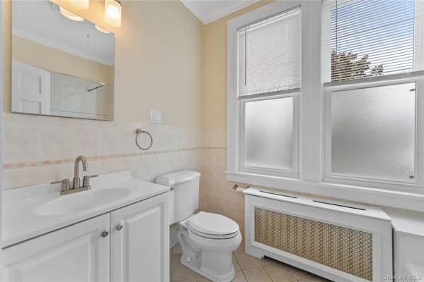 a bathroom with a sink toilet and vanity