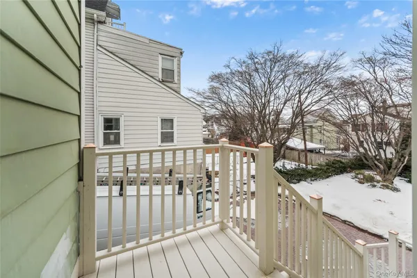 a view of a house with wooden fence