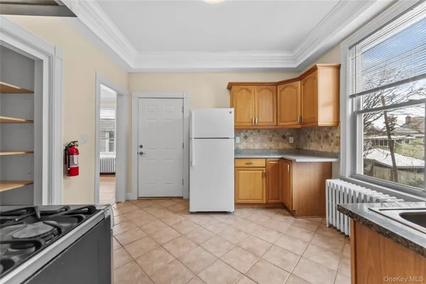 a kitchen with a sink stove and refrigerator