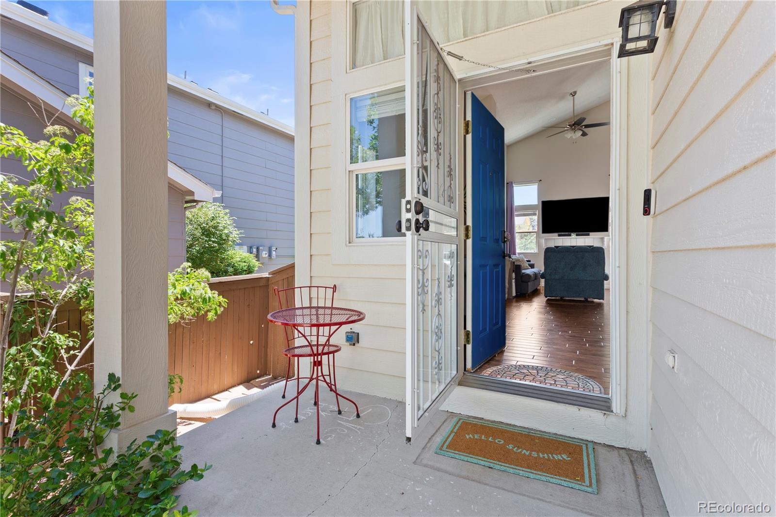 2212 Hyacinth Road Littleton, CO 80129 - Photo 5 of 44 a view of balcony with two chairs and a potted plant