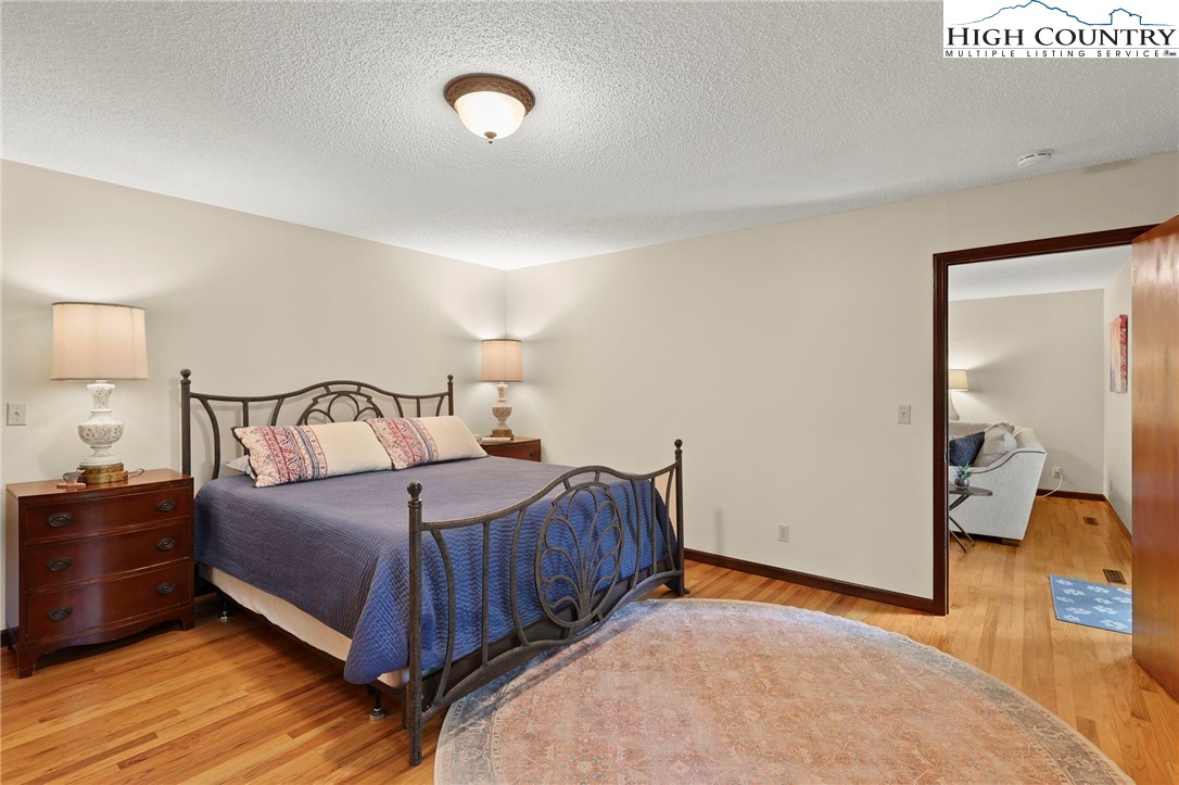 393 Trillium Ridge Boone, NC 28607 - Photo 22 of 50 a bedroom with a bed and walk in closet