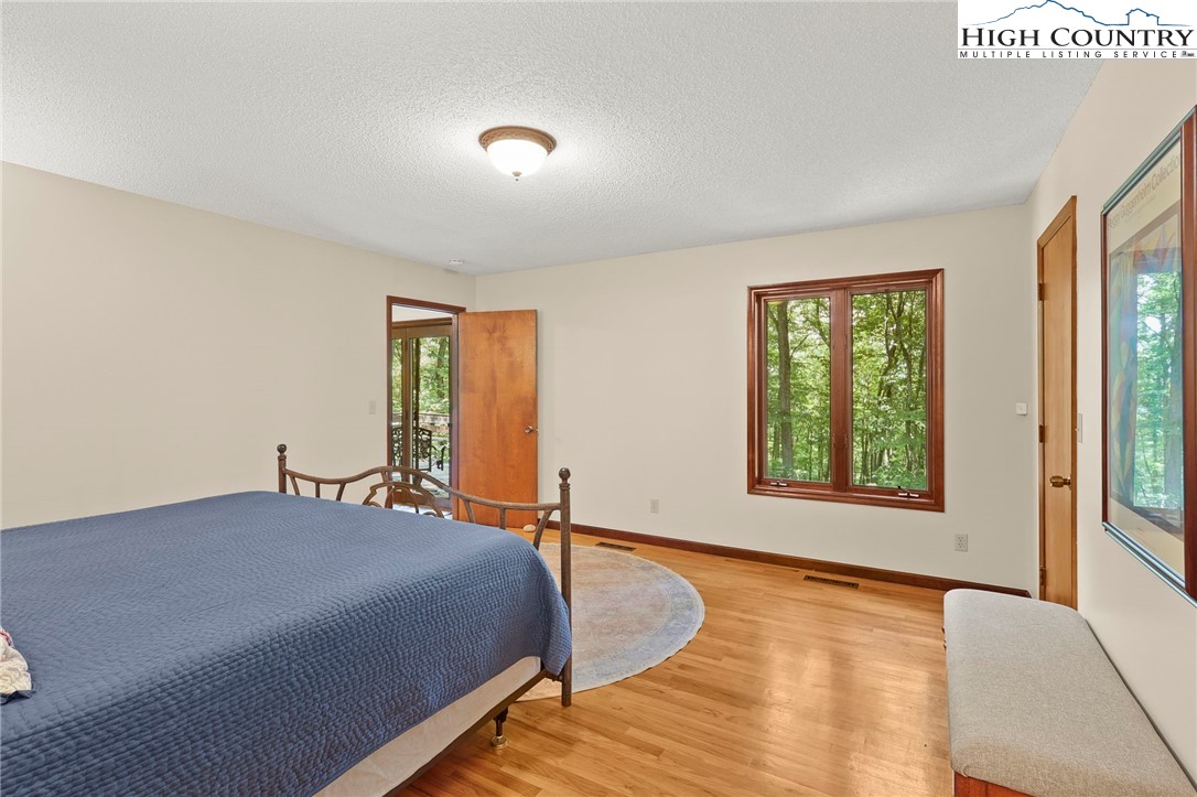 393 Trillium Ridge Boone, NC 28607 - Photo 23 of 50 a bedroom with a bed and window