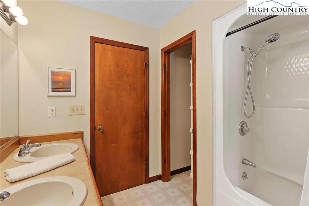 393 Trillium Ridge Boone, NC 28607 - Photo 26 of 50 a bathroom with a sink toilet and shower