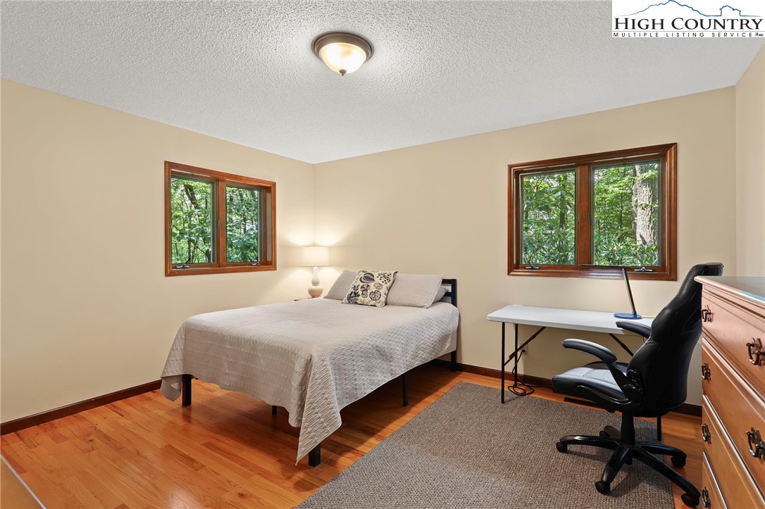 393 Trillium Ridge Boone, NC 28607 - Photo 28 of 50 a bedroom with a bed and a desk