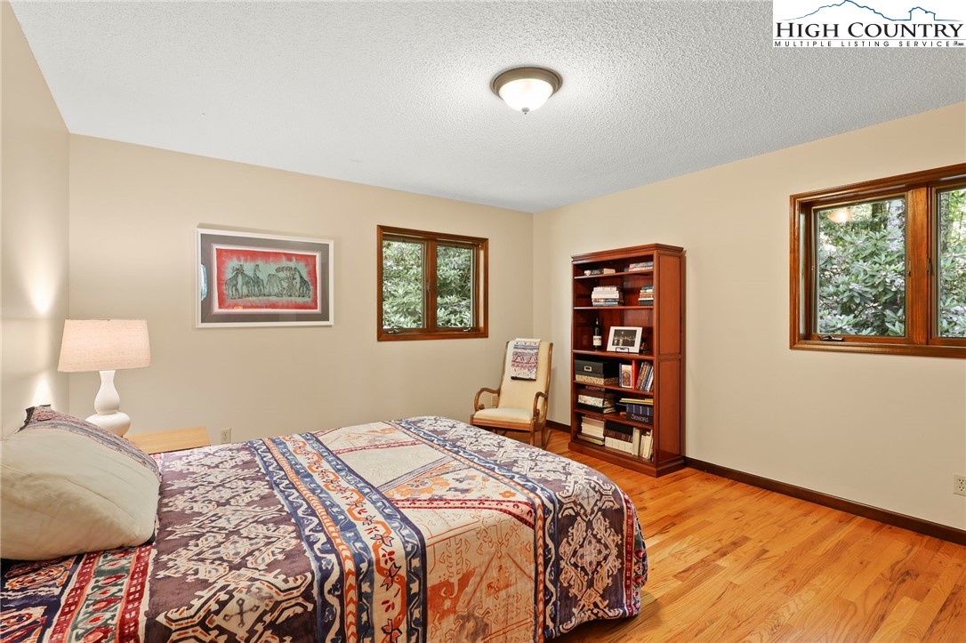 393 Trillium Ridge Boone, NC 28607 - Photo 31 of 50 a bedroom with a large bed and a window