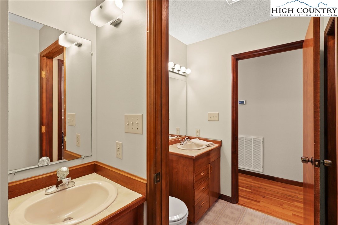 393 Trillium Ridge Boone, NC 28607 - Photo 32 of 50 a bathroom with a sink and a mirror