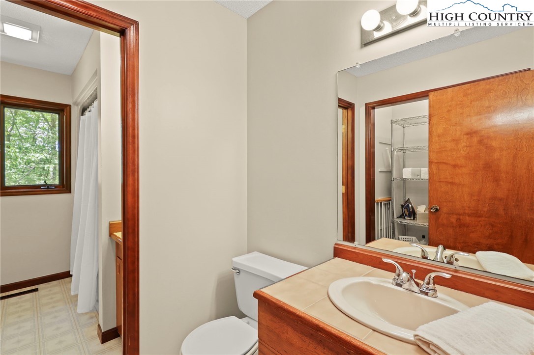 393 Trillium Ridge Boone, NC 28607 - Photo 33 of 50 a bathroom with a sink and a mirror