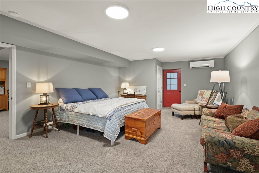 393 Trillium Ridge Boone, NC 28607 - Photo 39 of 50 a bedroom with bed and a couch