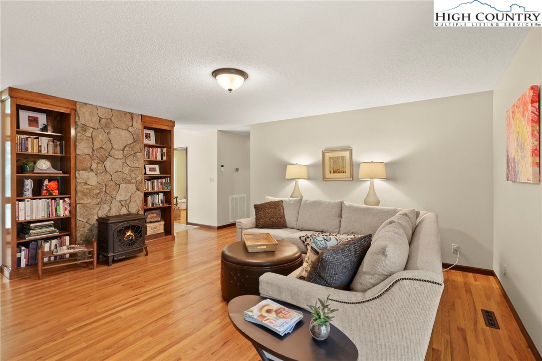 393 Trillium Ridge Boone, NC 28607 - Photo 10 of 50 a living room with furniture and a book shelf