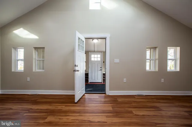 a view of livingroom with hardwood floor and window in wooden floor