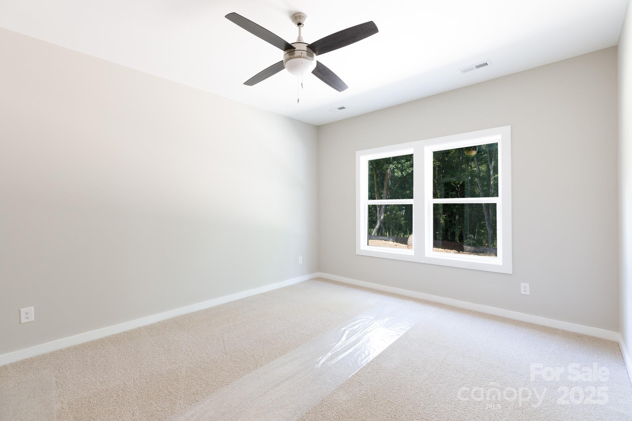 3339 Lesslie Highway, Unit 2 Rock Hill, SC 29730 - Photo 25 of 42 an empty room with a window and a ceiling fan