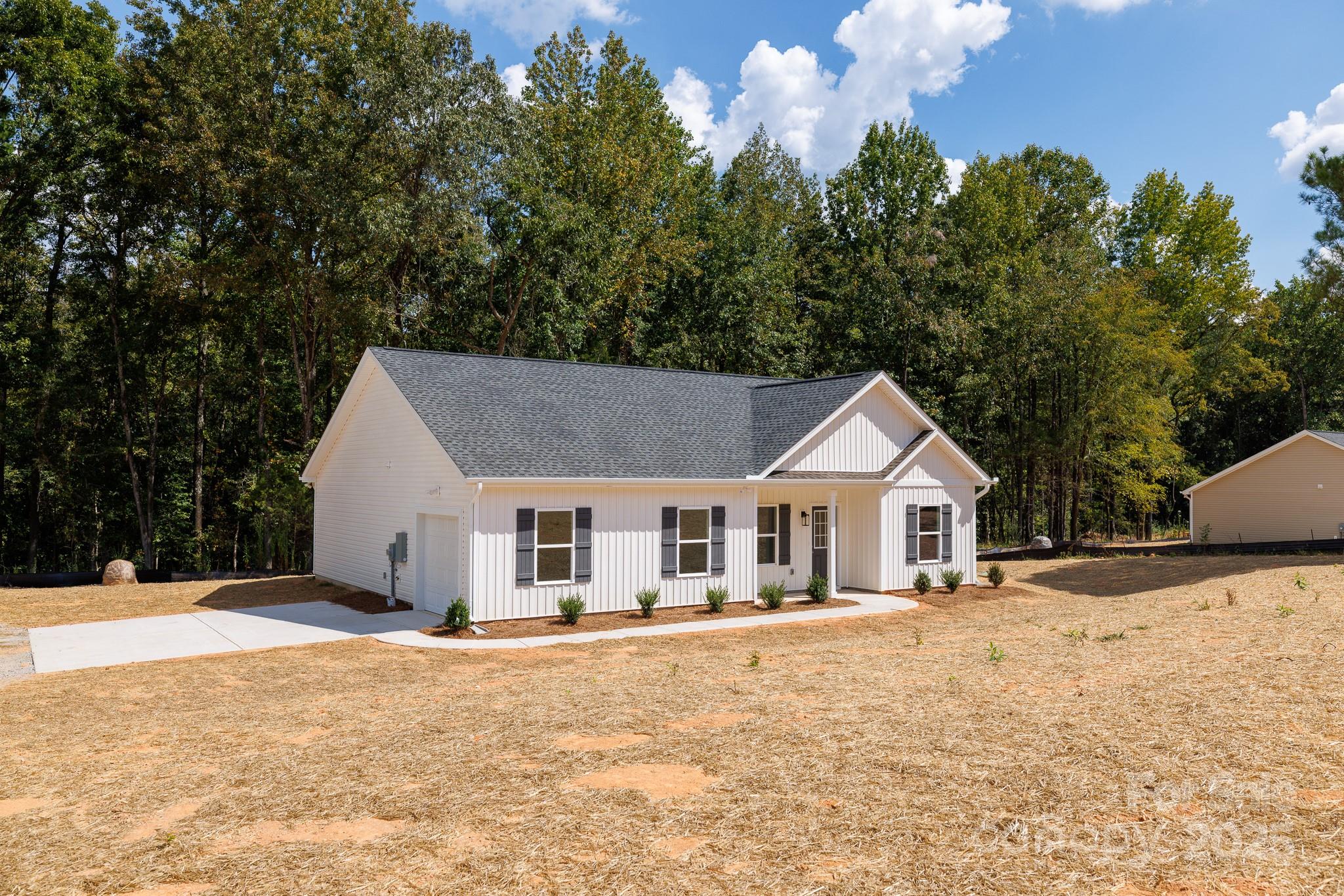 3339 Lesslie Highway, Unit 2 Rock Hill, SC 29730 - Photo 32 of 42 a front view of a house with a yard covered with snow