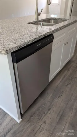a close view of kitchen countertops with wooden floor