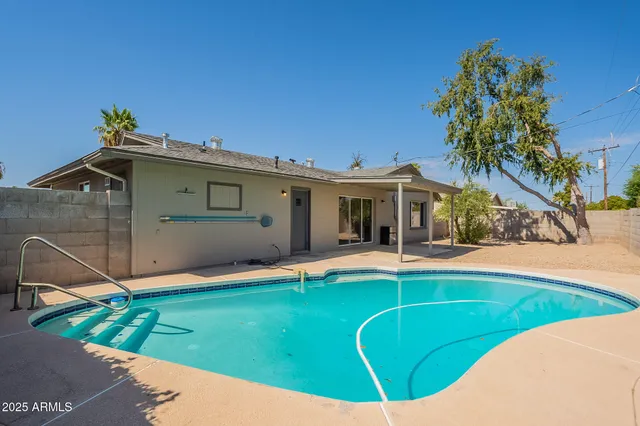 a view of a house with swimming pool