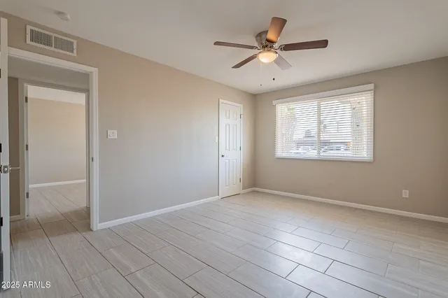 a bathroom with a granite countertop toilet a sink and bathtub