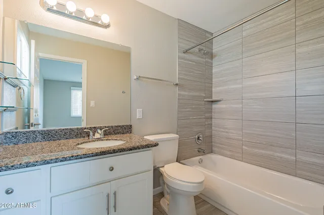 a view of a hallway with washer and dryer