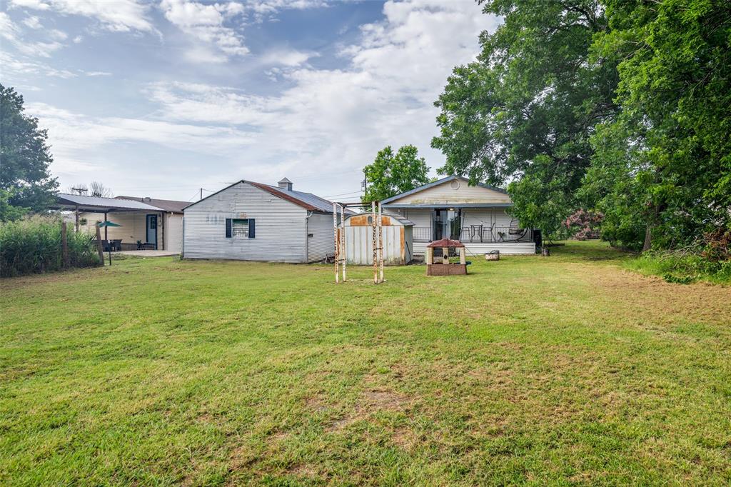113 Caddo Street Josephine, TX 75173 - Photo 25 of 31 a front view of a house with garden