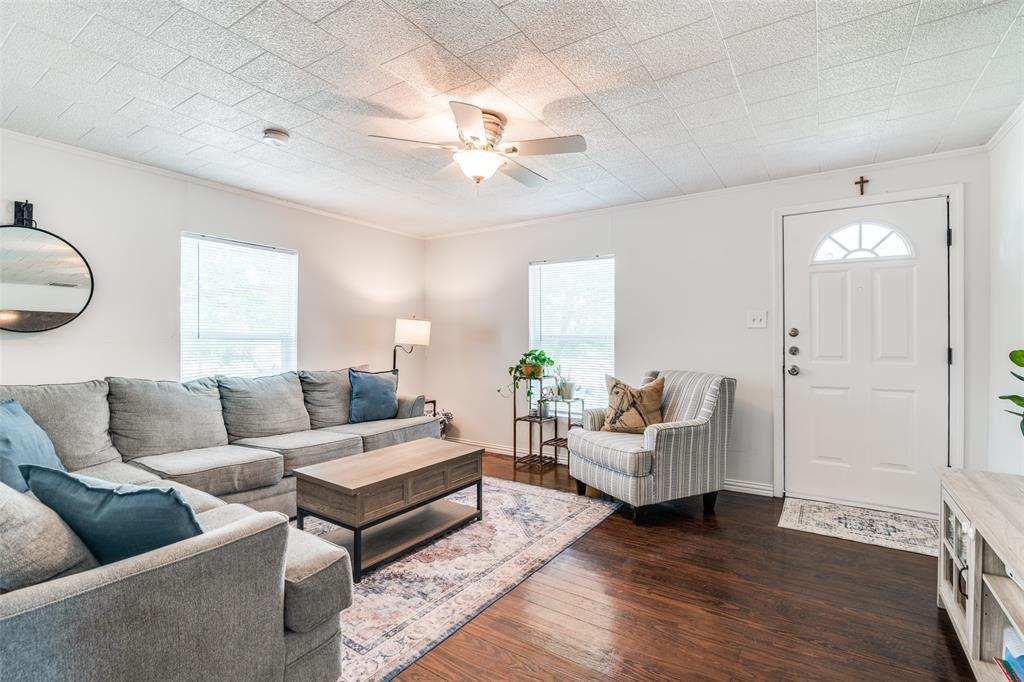 113 Caddo Street Josephine, TX 75173 - Photo 3 of 31 a living room with furniture and a chandelier