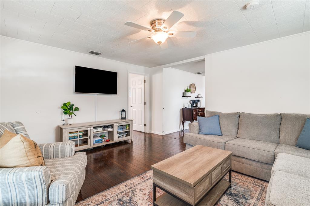 113 Caddo Street Josephine, TX 75173 - Photo 4 of 31 a living room with furniture and a flat screen tv