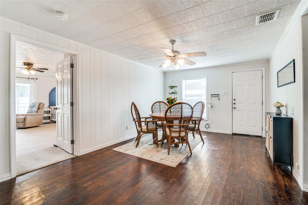 113 Caddo Street Josephine, TX 75173 - Photo 9 of 31 a view of a dining room with furniture and wooden floor