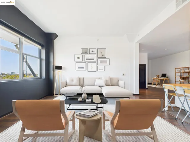 a room with furniture a large window and a table