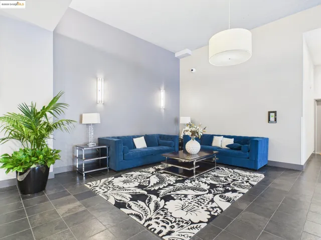 a living room with furniture and flowers