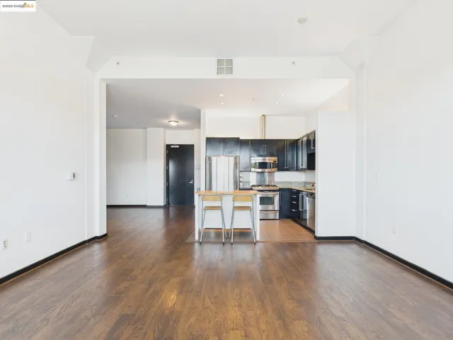 a view of kitchen and wooden floor